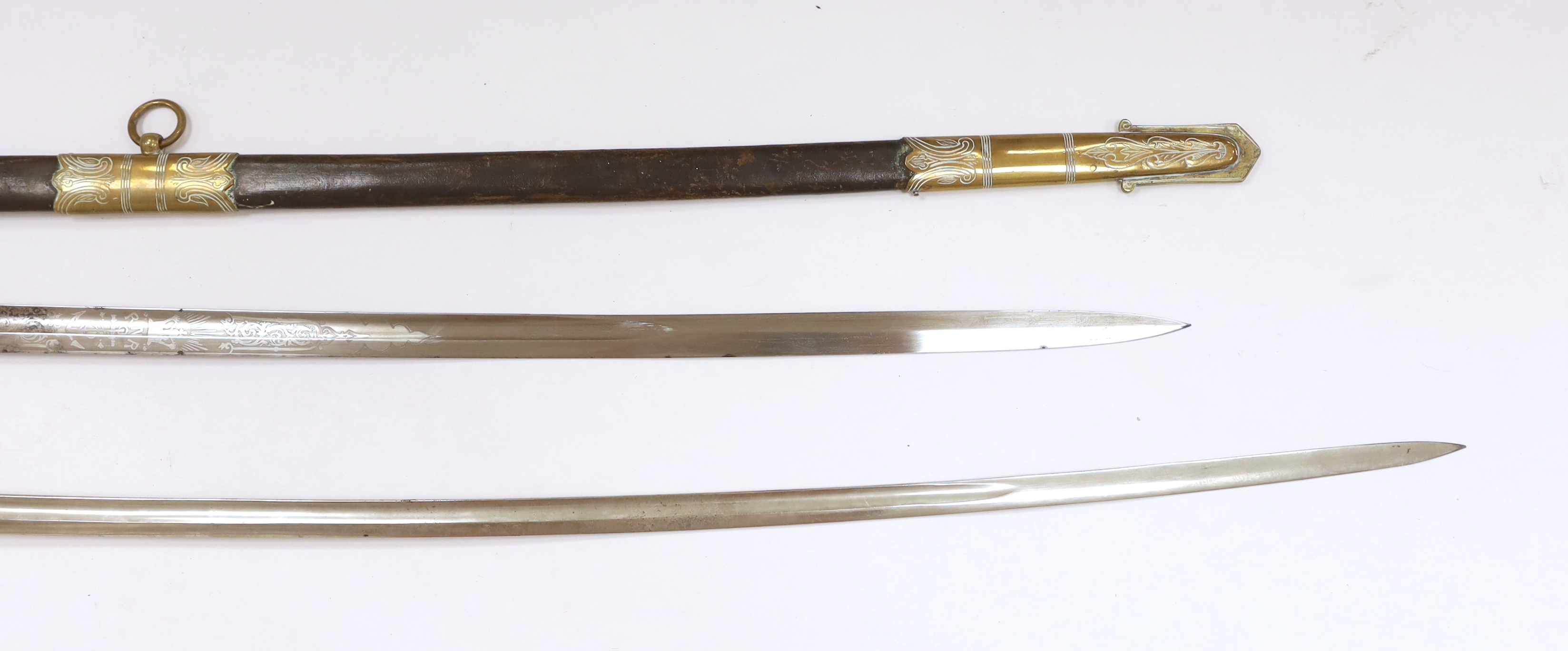 Victorian Royal Naval Reserves dress sword in brass and leather scabbard, blade 79.7cm and one other dress sword